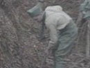 Working on the trench under wire-netting camouflage, November 2006.