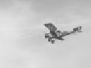 An Allied fighter plane (Sopwith Camel) flies over the battlefield, November 2006.