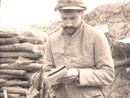 Sgt. Contamine filling out reports on the unit's supplies and ammo at stand-to, April 2008.