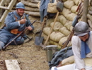 Sgt. Contamine sewing buttons back on his trousers in a revealing moment, April 2008.