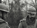 Sgt. Contamine discusses with American trainees the use of offensive hand grenades in clearing an enemy trench, April 2010.