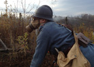 A soldier of 151 RI wearing his gas mask. Newville, November 2013.