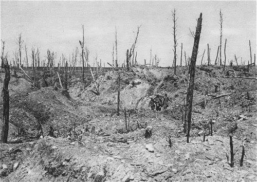 Almost lost in the devastation, a group of French stretcher-bearers bearing a wounded man across Hill 304 on the Left Bank of the Meuse, Verdun. 