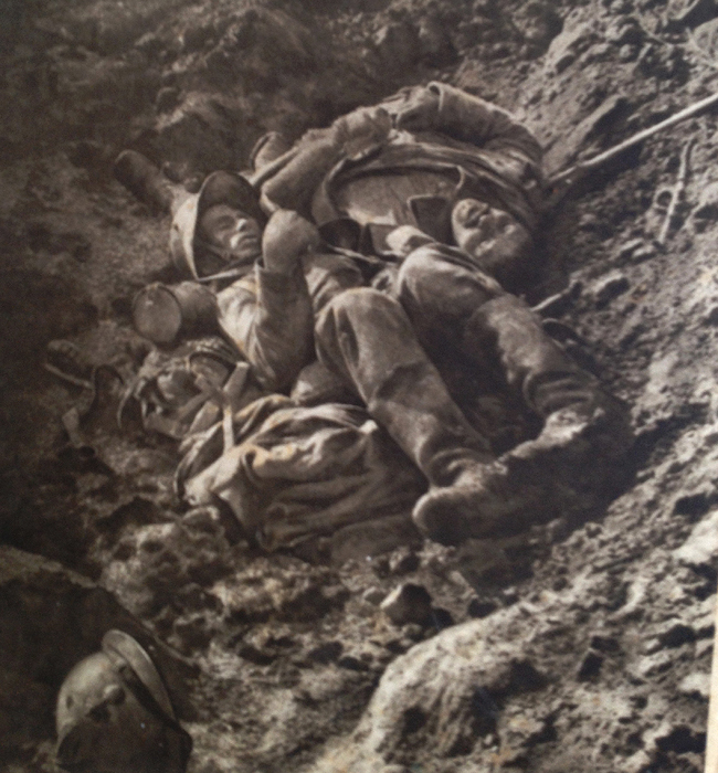 The body of a French soldier lies beside that of a German, at Combles (Somme) in October 1916.