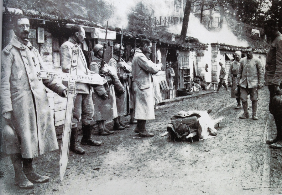 Sgt. Albert Pierre of the 23e RI is given an funeral with full honors just behind the front lines. Photo taken by Frantz Adam, at La Harazée Sept. 1916.