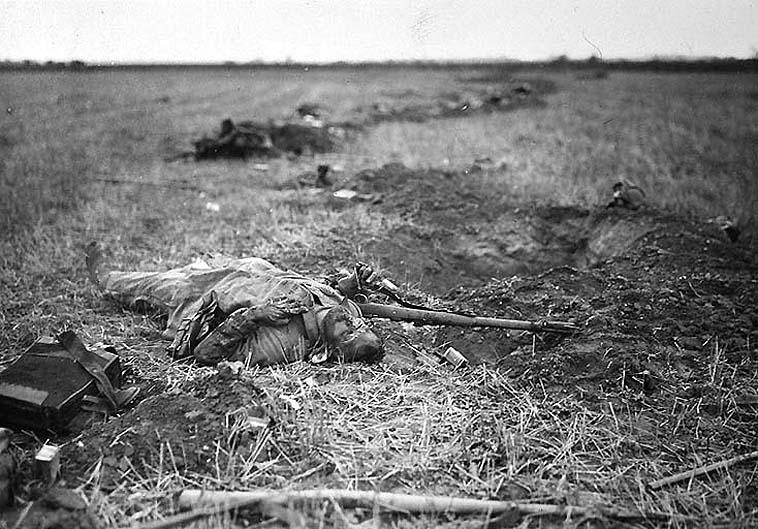A soldier slain beside a hastily constructed rifle-pit at Muy-en-Multien (Marne).