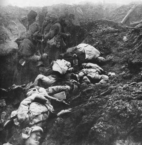 Note that the dead French soldiers piled up on the sides of the trench wear the new horizon-blue uniforms while the relieving unit retains the old uniform.