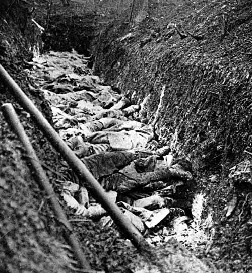 French dead piled up in mass grave.