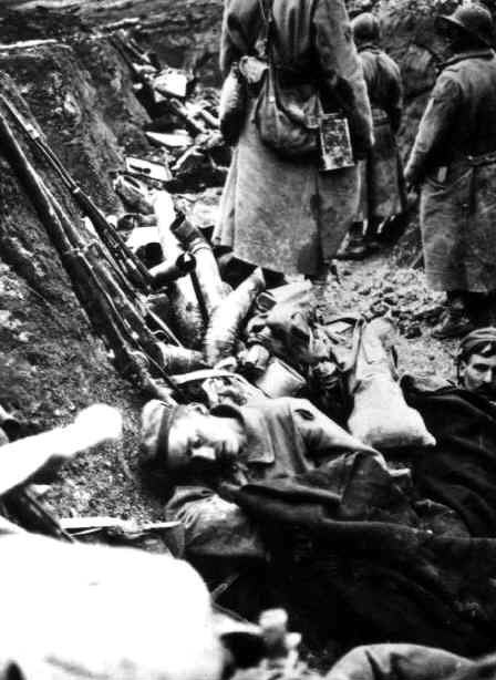 French soldier walking through a newly conquered trench.