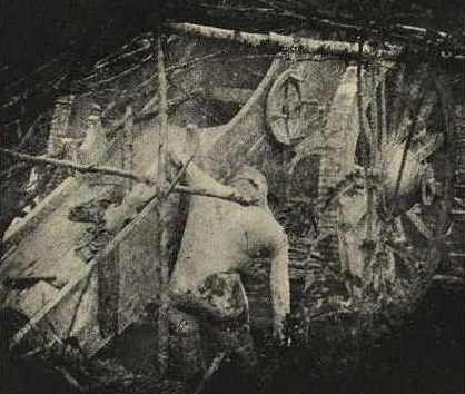 The mutilated body of an artillerist still mans his piece, Verdun.