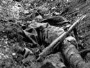 Destroyed Renault tank and dead French soldier.