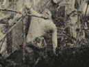 The mutilated body of an artillerist still mans his piece, Verdun.